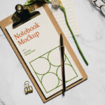 Realistic Notebook Mockup with Flower and glasses