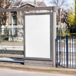 Realistic Poster Mockup at Bus Stop
