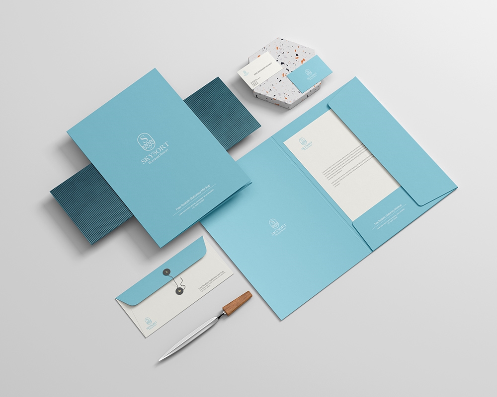 Realistic Stationery Mockup Featuring File, Envelope, Letterhead, and Business Card
