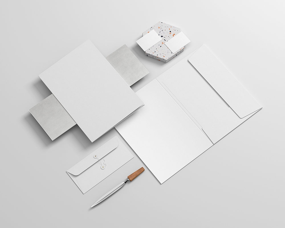 Realistic Stationery Mockup Featuring File, Envelope, Letterhead, and Business Card