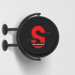 Round Signage Put up on the Wall in Half-Side View Mockup