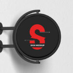Round Signage Put up on the Wall in Half-Side View Mockup