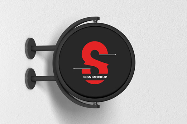 Round Signage Put up on the Wall in Half-Side View Mockup