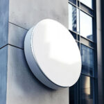 Round Signboard Mockup on Building Wall