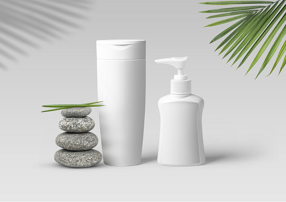 Shampoo and Lotion Bottle Mockup with Leaves and Stones