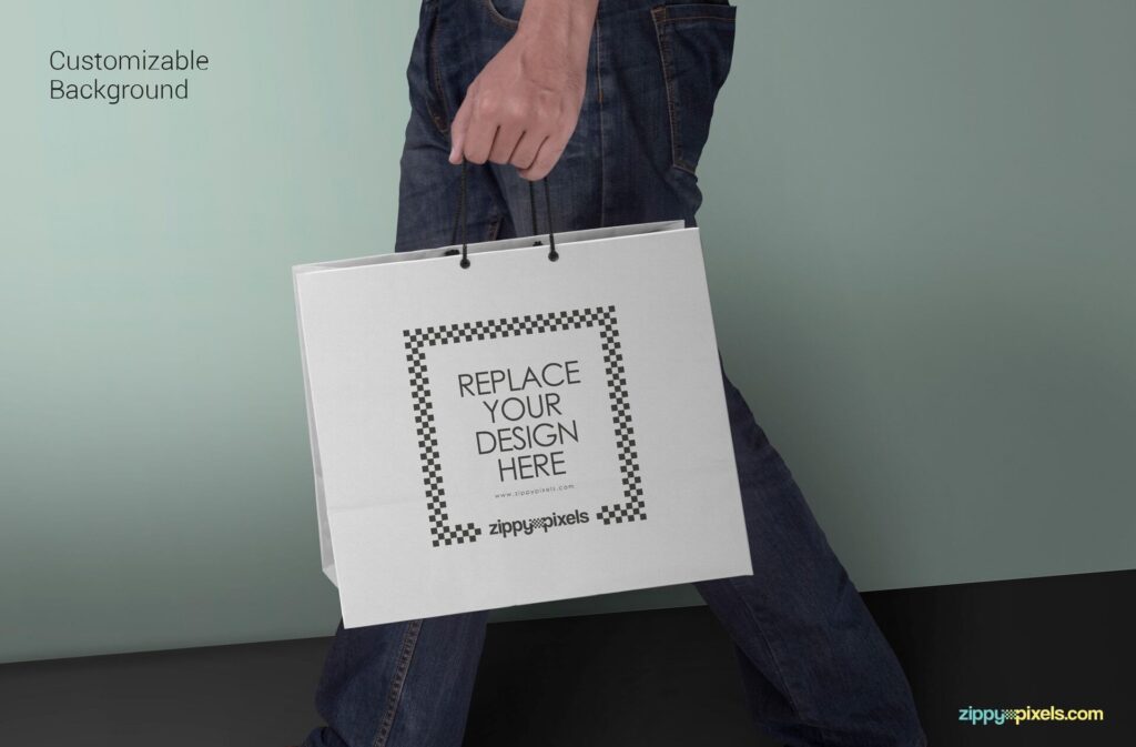 Side View Man Holding a Paper Shopping Bag Mockup