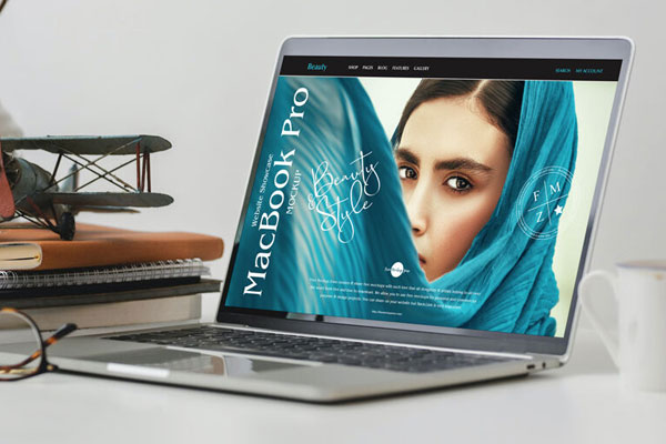 Side View of MacBook Pro Mockup Featuring Stationery Items