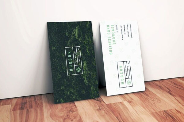Side View of Two Standing Business Cards against Wall Mockup