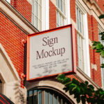Sign Mockup on Brick Building in Perspective View