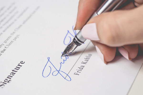 Signature Mockup of a Female Hand Holding a Fountain Pen