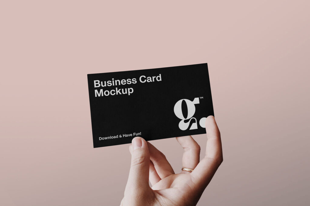 Single Business Card in a Person’s Hand Mockup