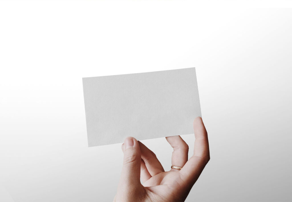 Single Business Card in a Person’s Hand Mockup