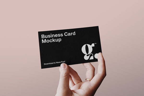 Single Business Card in a Person’s Hand Mockup