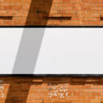 Small Billboard on Brick Wall Mockup