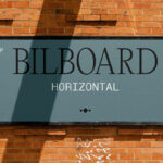 Small Billboard on Brick Wall Mockup