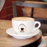 Small Coffee Cup on a Wooden Table Mockup