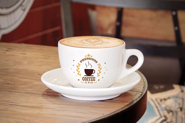 Small Coffee Cup on a Wooden Table Mockup