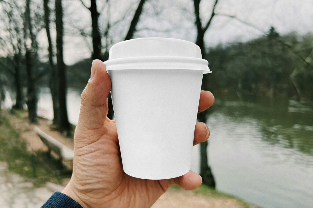 Small Paper Cup in Hand Mockup