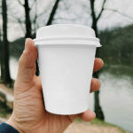 Small Paper Cup in Hand Mockup