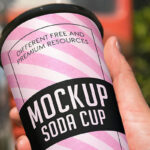Soda Paper Cup Grabbed by Hand in Perspective
