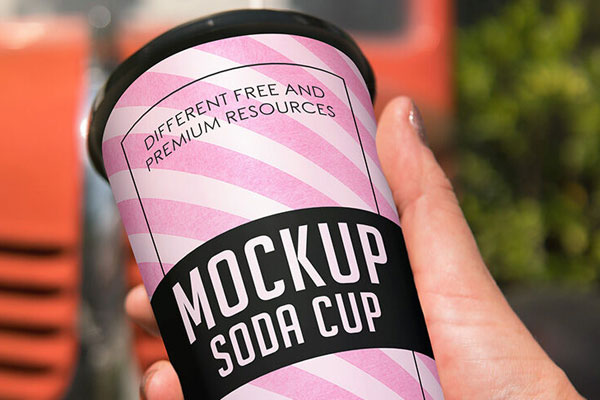 Soda Paper Cup Grabbed by Hand in Perspective
