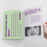 Spread Magazine Held by a Hand Mockup