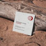 Square Business Card Mockup Laid on a Wood
