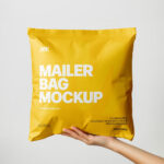 Square Paper Mailer Bag Mockup Holding by Hand
