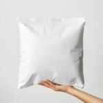 Square Paper Mailer Bag Mockup Holding by Hand