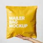 Square Paper Mailer Bag Mockup Holding by Hand