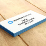 Stack of Professional Business Cards on a Wooden Surface Mockup
