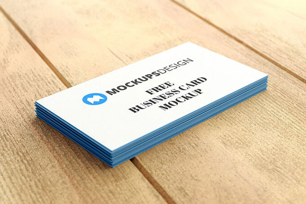 Stack of Professional Business Cards on a Wooden Surface Mockup