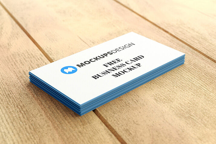 Stack of Professional Business Cards on a Wooden Surface Mockup
