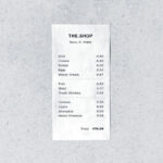 Store Receipt on a Concrete Surface From a Top View Mockup