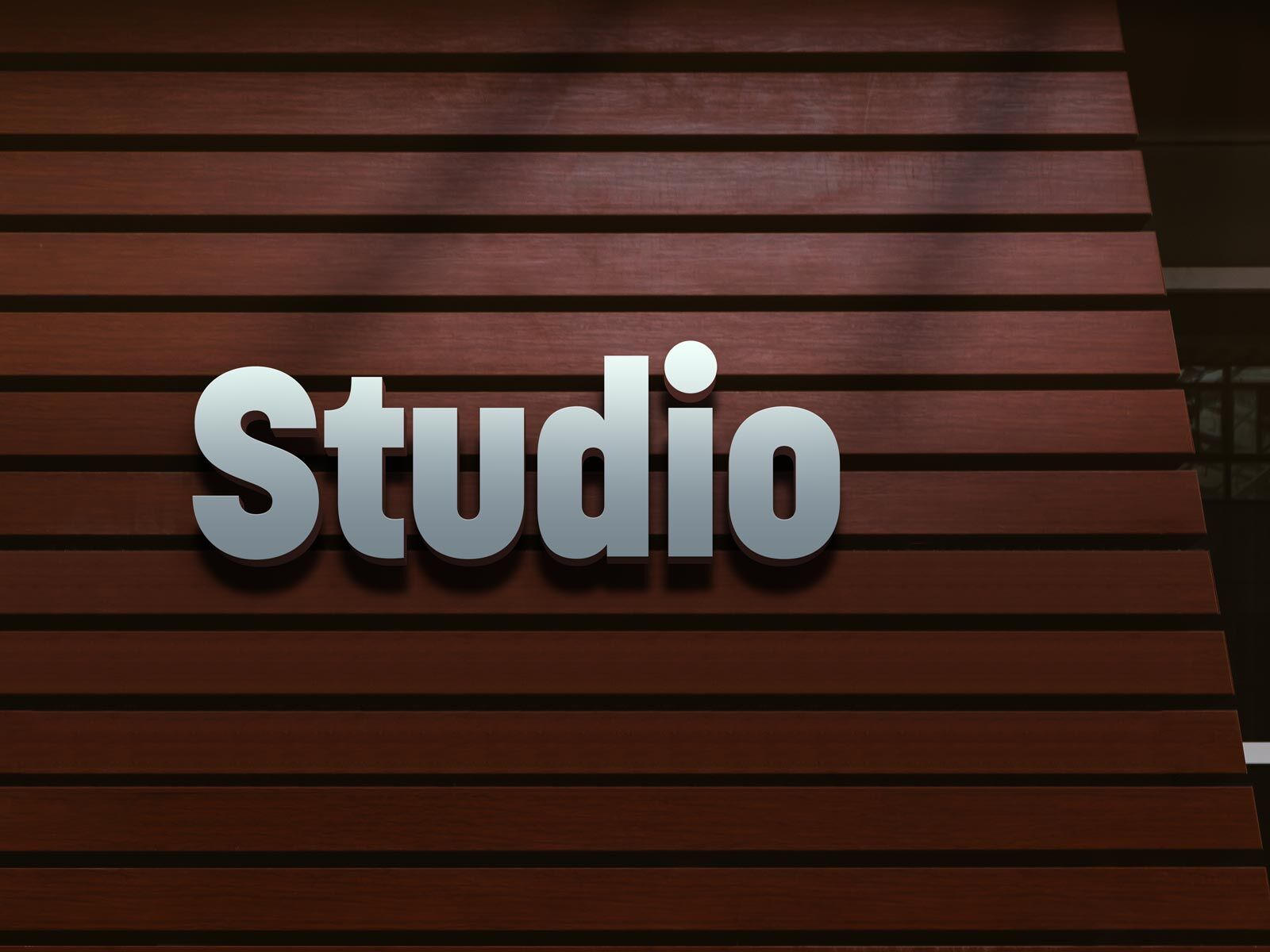 Studio Bold Logo Design Mockup on a Wooden Wall FREE PSD
