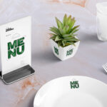 Table Menu Standee Mockup Scene with Plant, Glass, and Plate