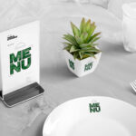 Table Menu Standee Mockup Scene with Plant, Glass, and Plate