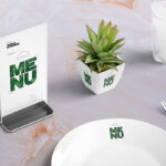 Table Menu Standee Mockup Scene with Plant, Glass, and Plate
