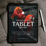 Tablet Placed on the Sofa in Top View Mockup