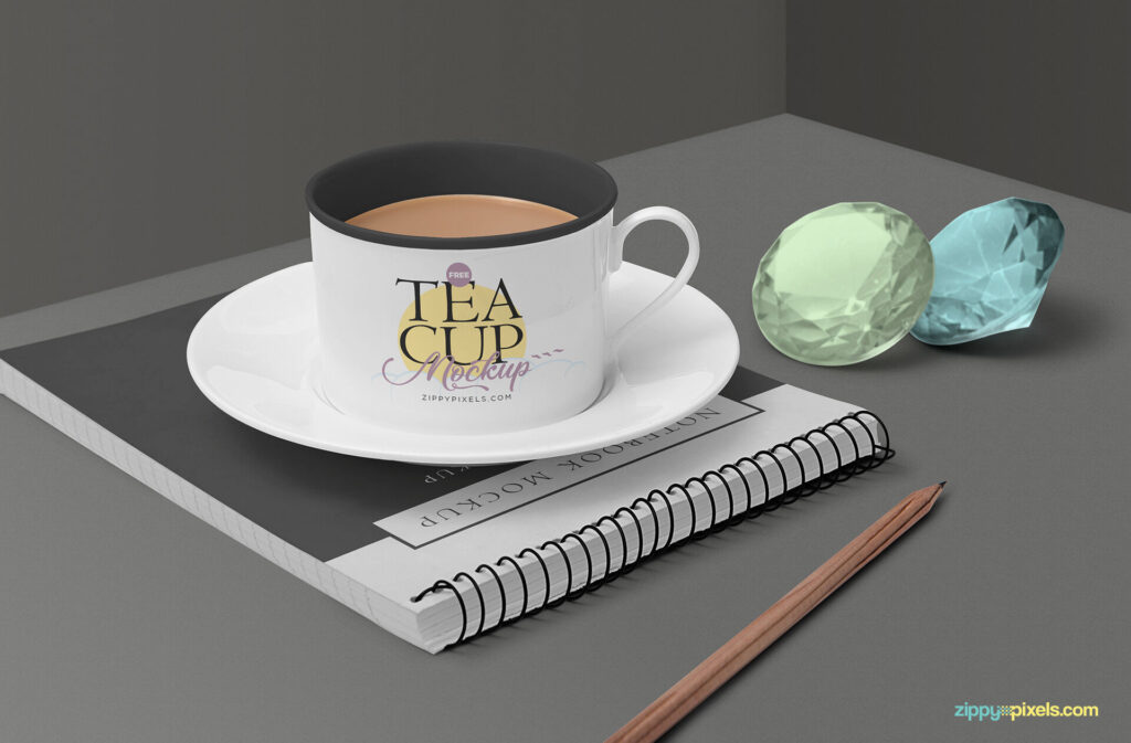 Tea Cup Mockup Featuring Ringed Notebook, Gemstones and a Pencil