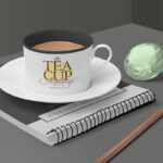 Tea Cup Mockup Featuring Ringed Notebook, Gemstones and a Pencil