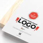 Textured Paper Logo Mockup on a Wooden Board