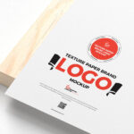 Textured Paper Logo Mockup on a Wooden Board