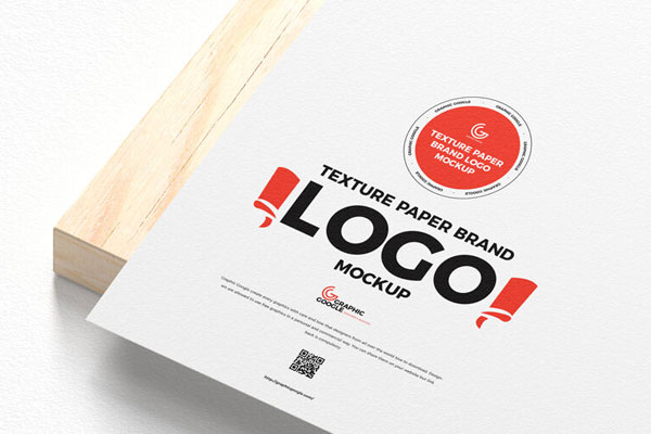 Textured Paper Logo Mockup on a Wooden Board