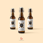 Three Amber Glass Beverage Bottles Mockup