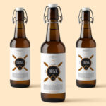 Three Amber Glass Beverage Bottles Mockup