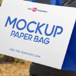 Three Paper Bag with Handle Mockups with an Outdoors Background