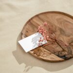 Top Side View of Business Card Mockup on Round Plate