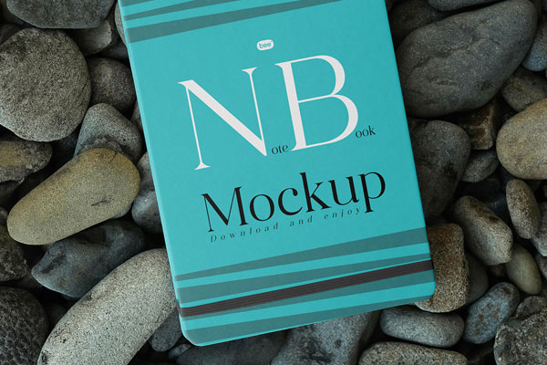 Top Sight of Notebook Cover Mockup on Stones