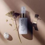 Top View Cosmetics Bottle Mockup with Flower